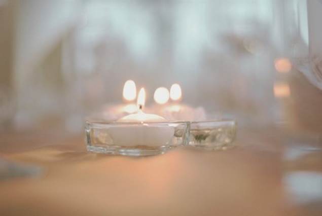 A close-up of several candles

Description automatically generated